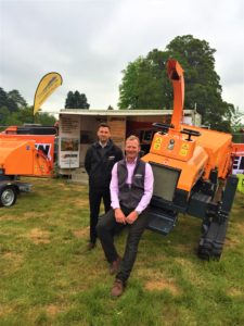 Nathan Jacobs and Bill Johnston on the Jensen woodchippers stand at Arb Show 2019