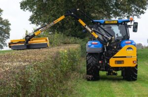 McConnel Power Arm 55-series on New Holland Tractor from Rear